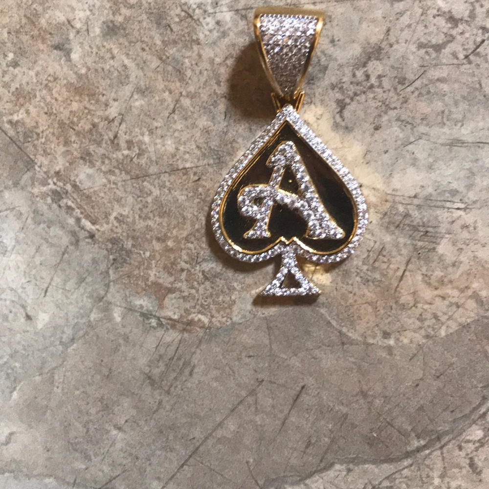 Gold overlay ace of spade emblem with chain